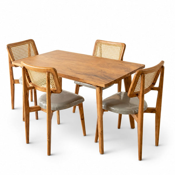 Wooden dining table with four matching chairs on a white background