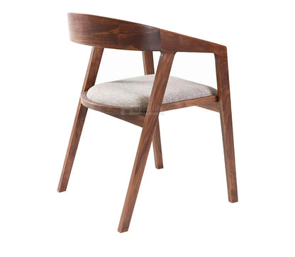 Wooden chair with a cushioned seat on a white background