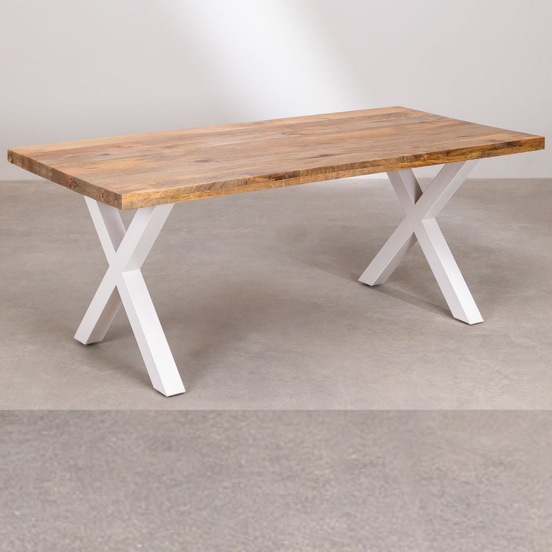 Wooden table with white X-shaped legs on a plain background