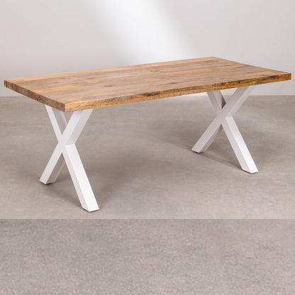 Wooden table with white X-shaped legs on a plain background