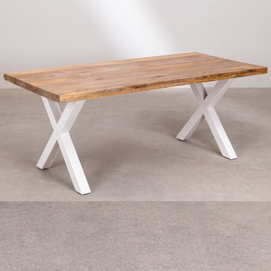 Wooden table with white X-shaped legs on a plain background