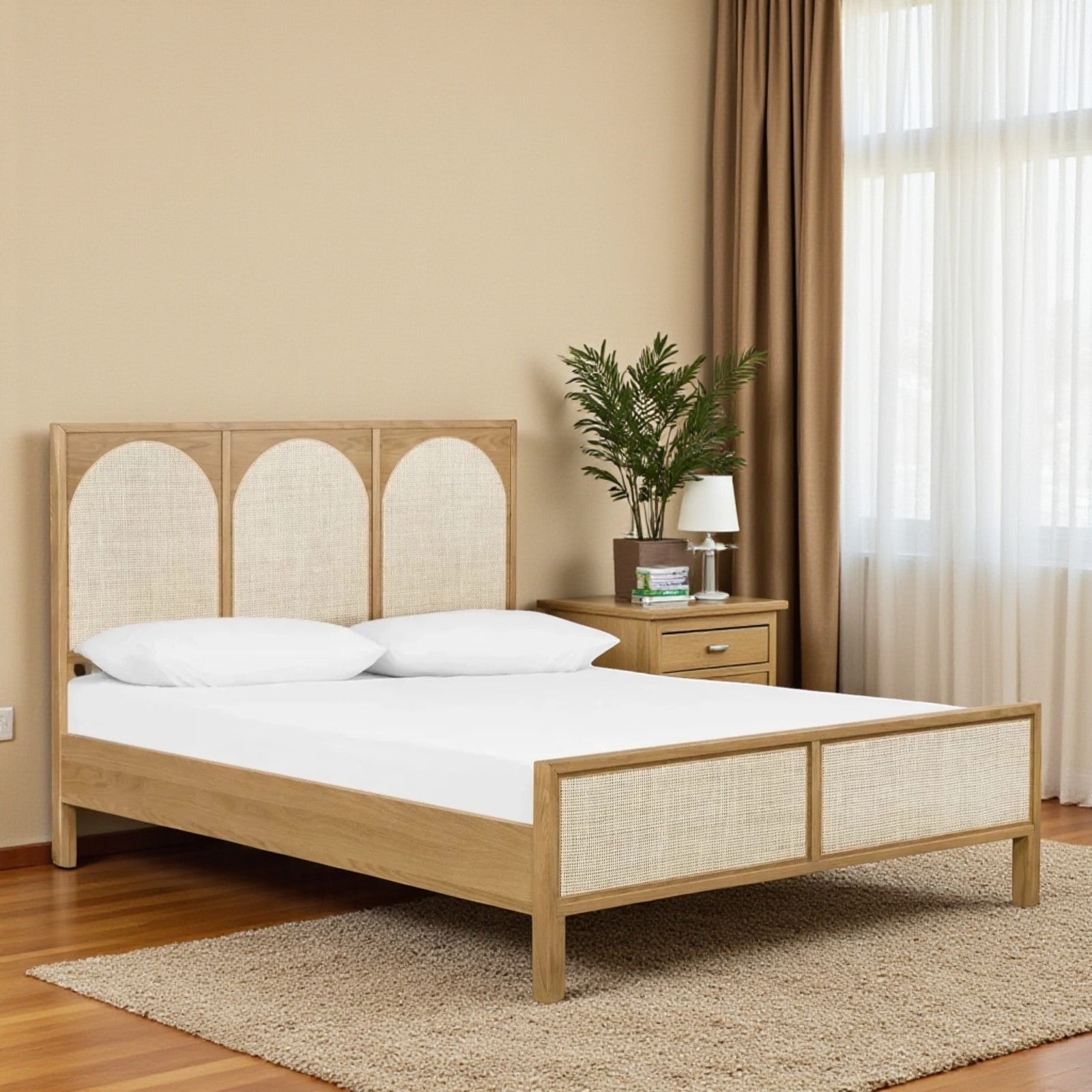 Wooden bed with white bedding in a bedroom setting