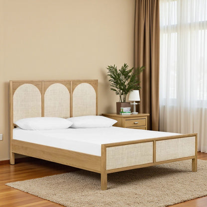 Wooden bed with white bedding in a bedroom setting