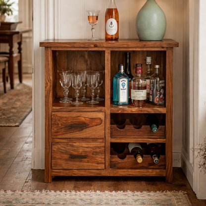 Wooden bar cabinet with drinks and glasses in a home setting