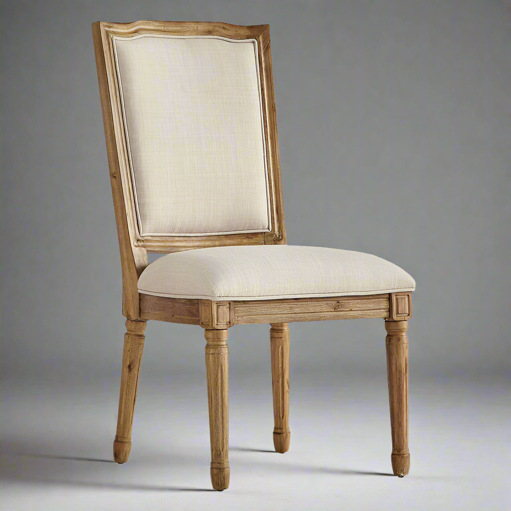 Wooden chair with beige upholstered seat and backrest on a white background