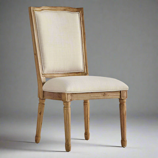 Wooden chair with beige upholstered seat and backrest on a white background