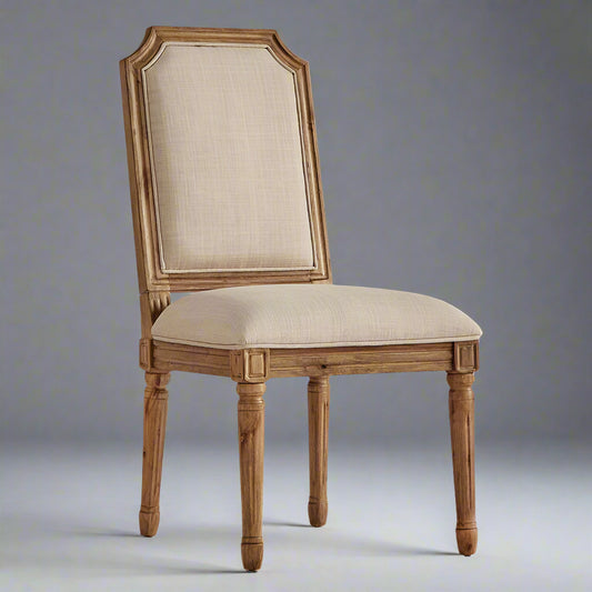 Wooden chair with beige upholstered seat and backrest on a white background