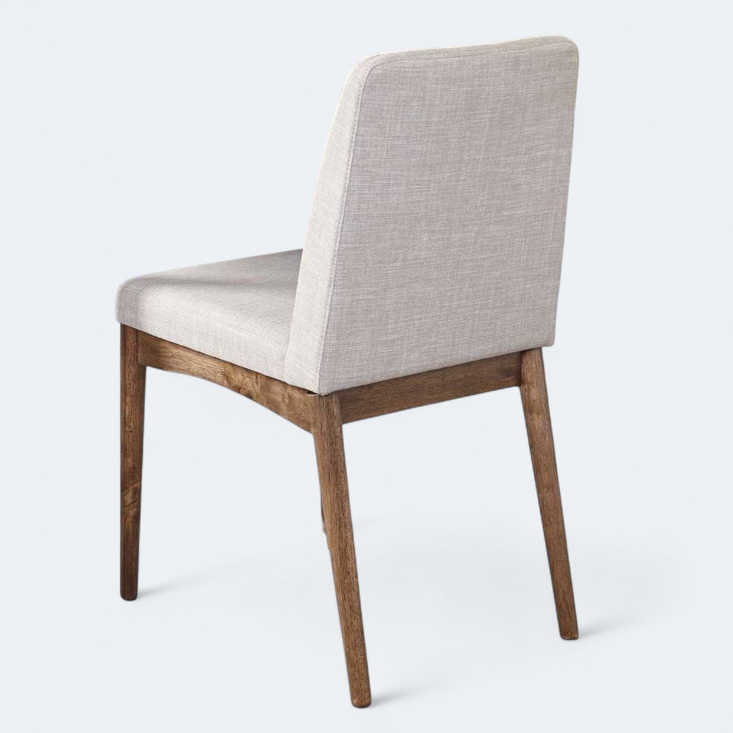 Chair with wooden legs and gray cushioned backrest on a white background
