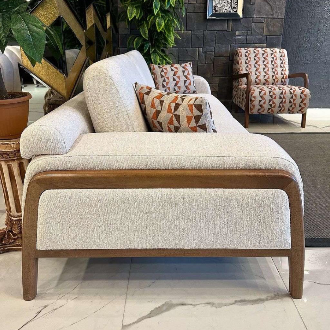 Modern living room with a beige sofa and patterned cushions,